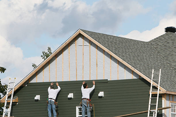 Professional Storm Damage Siding Repair technician working in Mansfield, OH